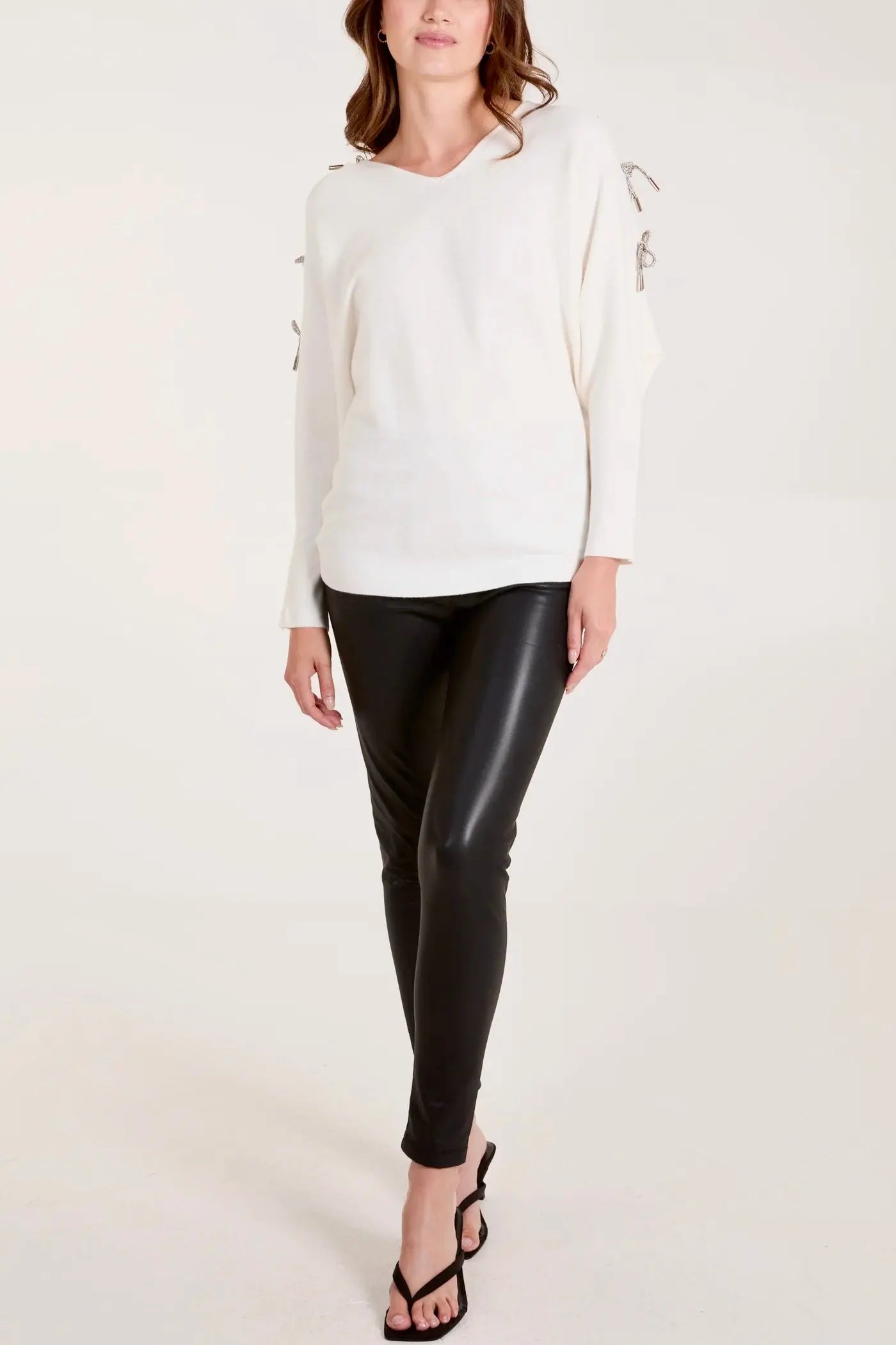 GLITTER BOW CUT OUT SLEEVE JUMPER The Style Closet