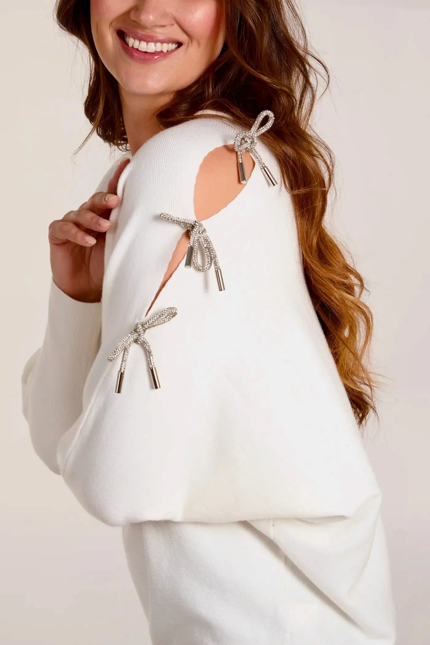 GLITTER BOW CUT OUT SLEEVE JUMPER The Style Closet