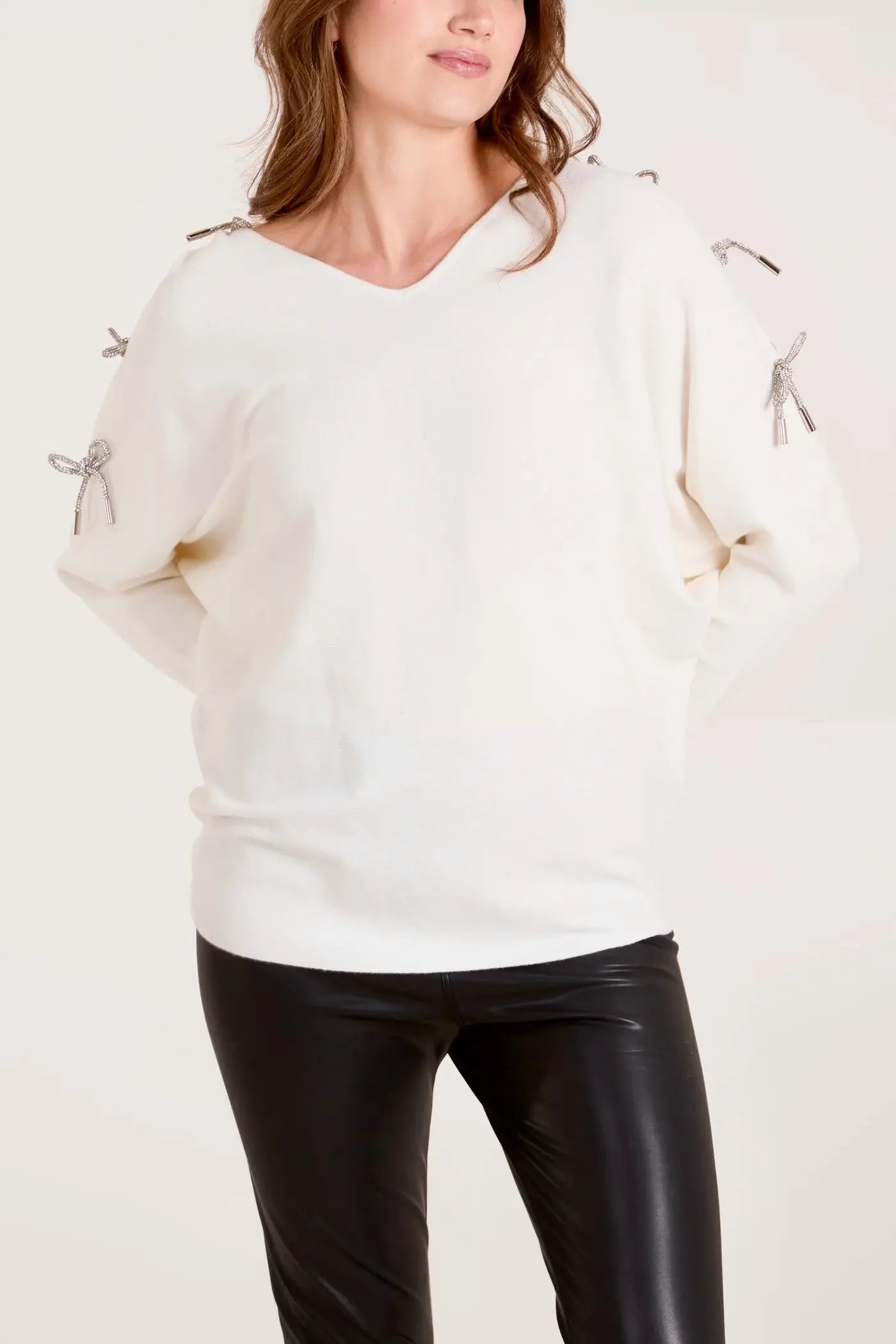 GLITTER BOW CUT OUT SLEEVE JUMPER The Style Closet