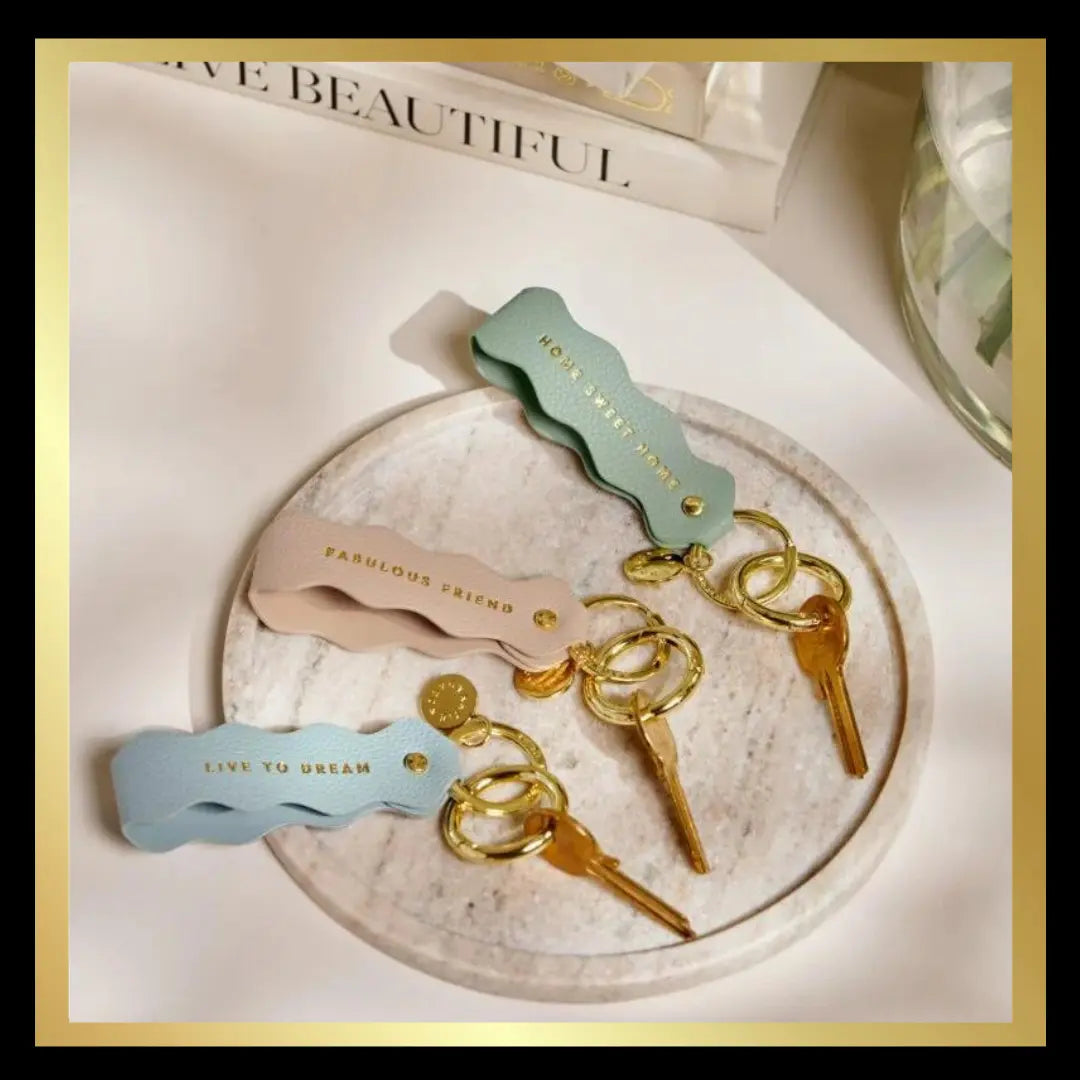 'Live To Dream' Sentiment Wave Keyring in Light Blue by Katie Loxton Katie Loxton